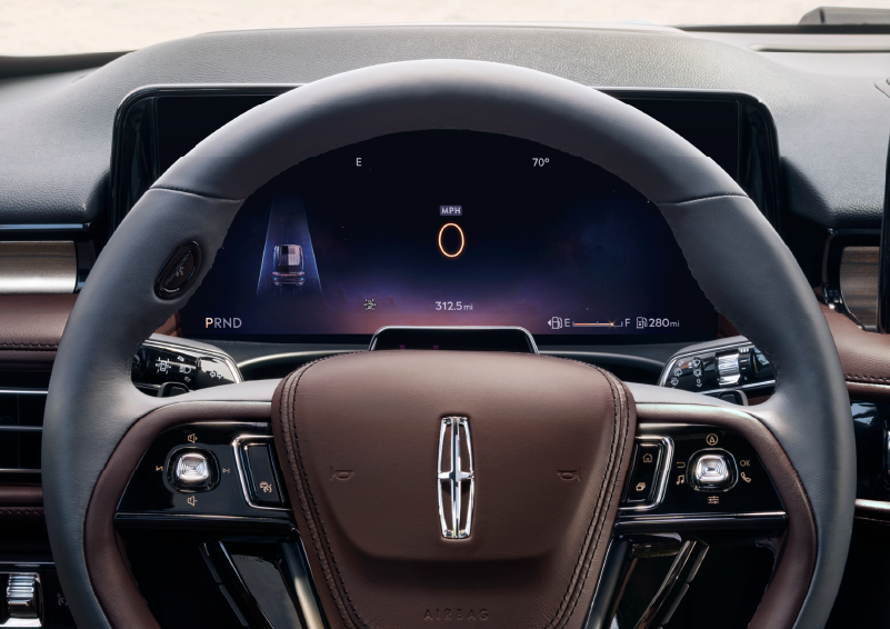 The steering wheel of 2025 Lincoln Aviator® SUV is shown with black and brown accents. | Empire Lincoln in Abingdon VA