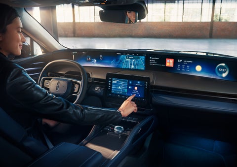The driver of a 2025 Lincoln Nautilus® SUV interacts with the center touchscreen. | Empire Lincoln in Abingdon VA