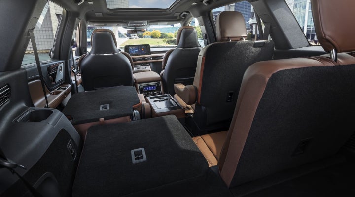 One side of the PowerFold® third-row seat and a second-row seat are folded forward in the 2026 Lincoln Aviator® SUV. | Empire Lincoln in Abingdon VA
