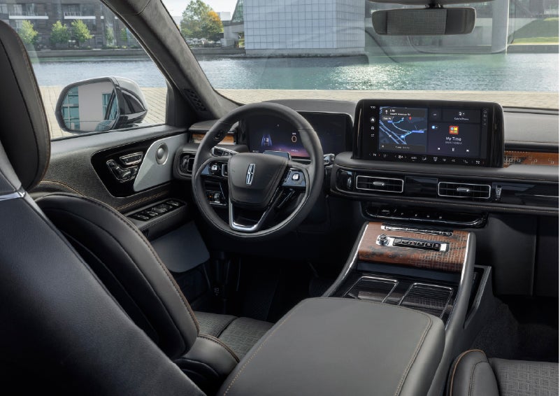 The interior of the 2026 Lincoln Aviator® SUV is shown parked with a view of a harbor through the windshield. | Empire Lincoln in Abingdon VA