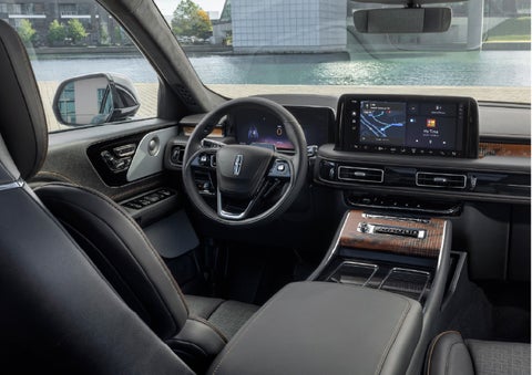 The interior of the 2026 Lincoln Aviator® SUV is shown parked with a view of a harbor through the windshield. | Empire Lincoln in Abingdon VA