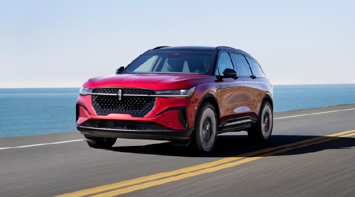 A 2026 Lincoln Nautilus® SUV is being driven on a seaside roadway. | Empire Lincoln in Abingdon VA