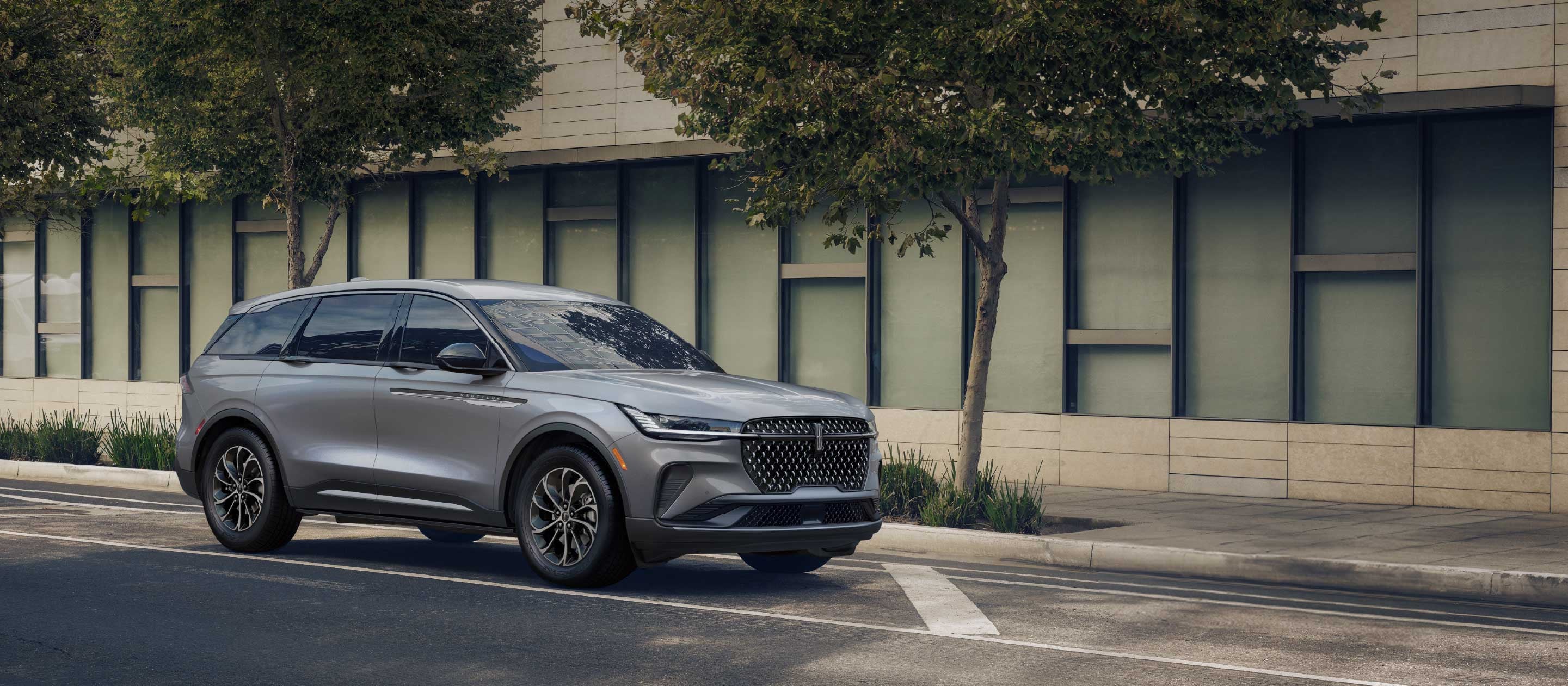 A 2025 Lincoln Nautilus® SUV is parked in a city setting.